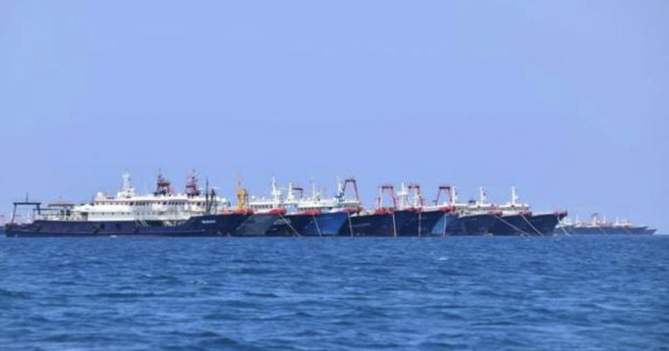 In this Sunday, March 7, 2021, photo provided Sunday, March 21, 2021, by the Philippine Coast Guard/National Task Force-West Philippine Sea, some of the 220 Chinese vessels are seen moored at Whitsun Reef, South China Sea. The Philippine government expressed concern after spotting more than 200 Chinese fishing vessels it believed were crewed by militias at a reef claimed by both countries in the South China Sea, but it did not immediately lodge a protest. (Philippine Coast Guard/National Task Force-West Philippine Sea via AP)