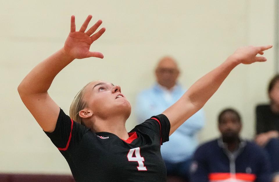 Center Grove Trojans Sophie Sabol (4) prepares to hit the ball Thursday, Sept. 14, 2023, during the game at Brebeuf Jesuit Preparatory School in Indianapolis. The Center Grove Trojans defeated Brebeuf Jesuit, 3-2.