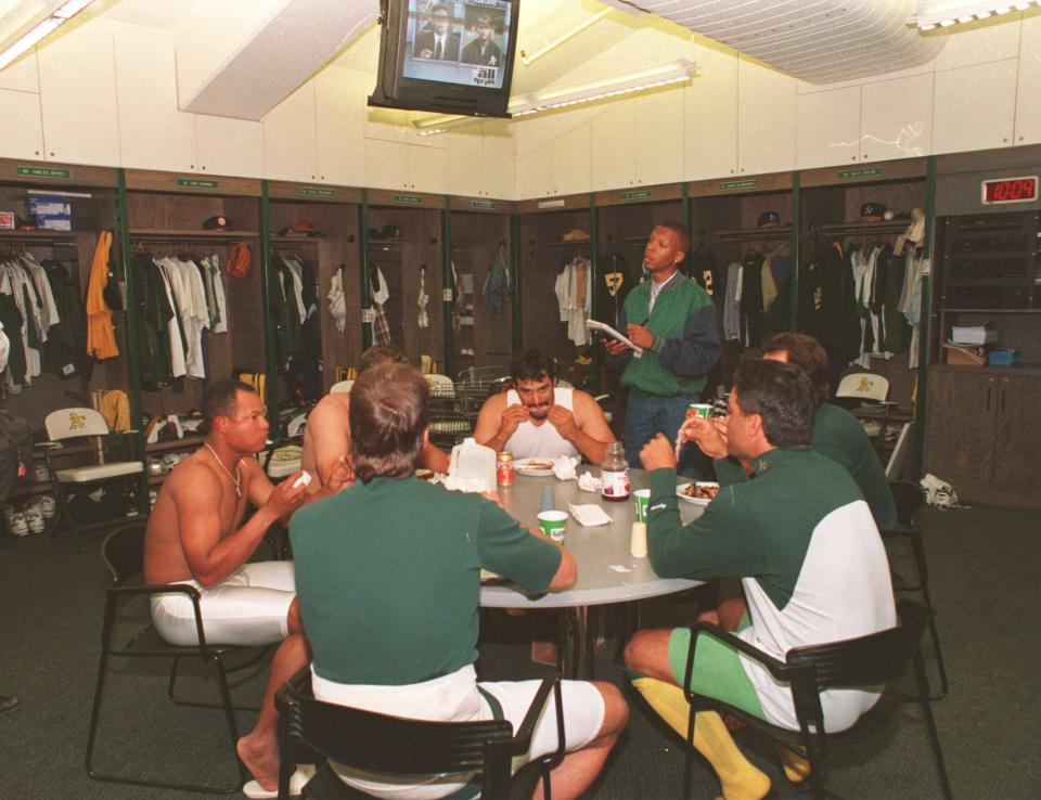 Players from the Oakland Athletics eating dinner in the clubhouse after their final game in the 1994 season. (Getty Images)