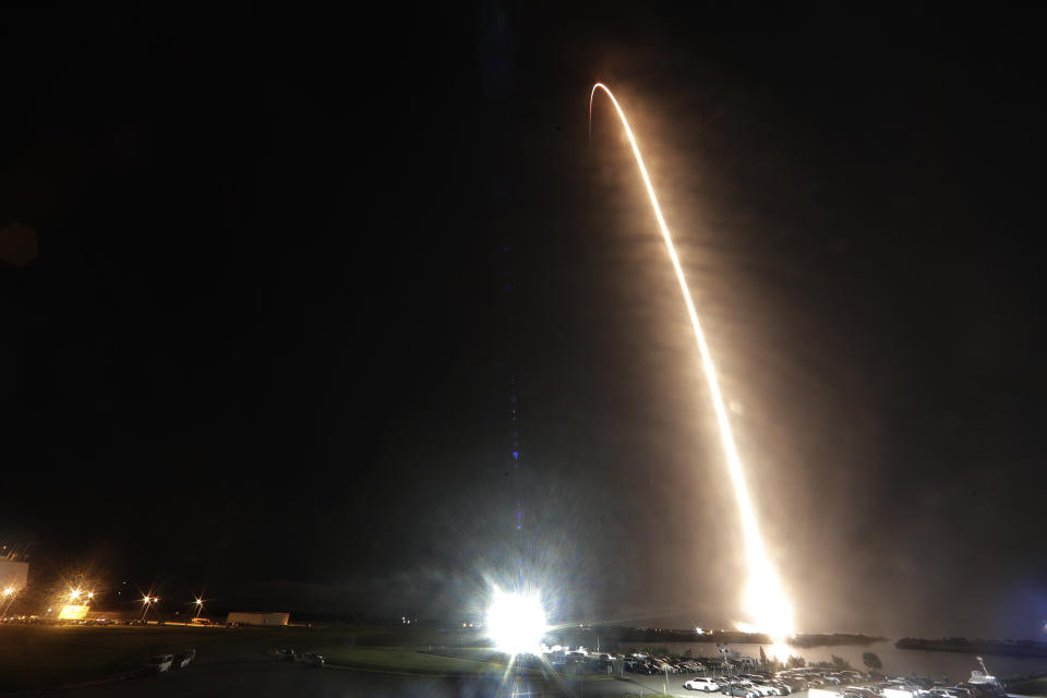 A Falcon 9 SpaceX rocket with the Crew Dragon capsule is seen during a time exposure as it lifts off from pad 39A at the Kennedy Space Center in Cape Canaveral, Fla., Sunday, Nov. 15, 2020. Four astronauts are beginning a mission to the International Space Station. (AP Photo/John Raoux)