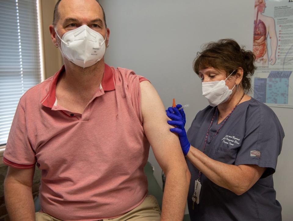 Nurse practictioner Patti Parker administers a monkeypox vaccine to Steve Kleinedler, of Winchester, at the JRI Health state backed monkeypox vaccination site in Framingham, July 25, 2022.