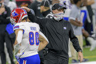 Louisiana Tech head coach Skip Holtz pats the helmet of wide receiver Griffin Hebert (80) during the first half of the New Orleans Bowl NCAA college football game against Georgia Southern in New Orleans, Wednesday, Dec. 23, 2020. (AP Photo/Matthew Hinton)