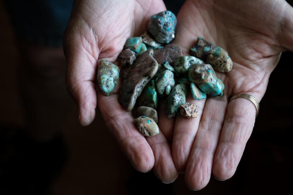 Carolyn Shafer, with the Patagonia Area Resource Alliance, holds turquoise she mined from the claim she used to own in the area on June 18, 2023, in Patagonia.