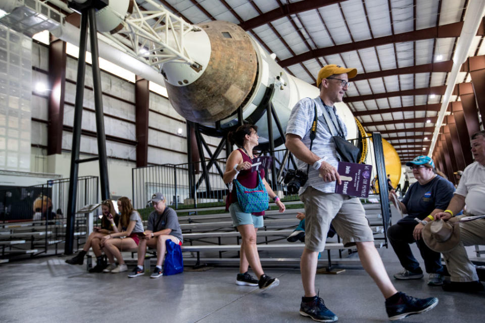 Russ Bailey walks past the command module of the Saturn V rocket at Rocket Park during the 50th anniversary of the Apollo 11 moon landing at Space Center Houston on Saturday, July 20, 2019, in Houston.