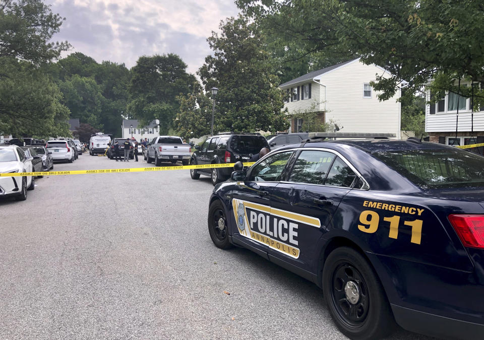 The FBI and other law enforcement agencies investigate the scene Monday, June 12, 2023 where six people were shot, three fatally, at a home in Annapolis, Md. Sunday evening. (Luke Parker/The Baltimore Sun via AP)