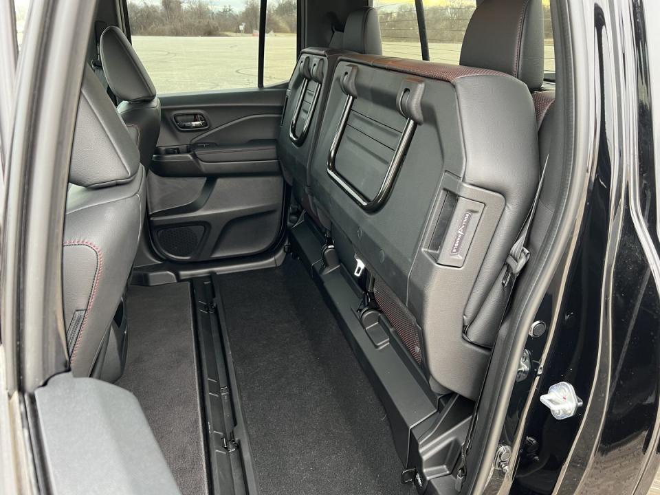 <p>The rear bench in the 2023 Ridgeline is well-suited for passengers and storage alike. Good legroom and the ability to fold up the seat bottoms with one pull of a handle makes modular usage simple and straightforward. </p><p>With the seats folded up, you can fit anything from bicycles to televisions behind the front seats without having to risk throwing them into the bed—particularly handy if you're parking on the street without any sort of bed cover. </p>