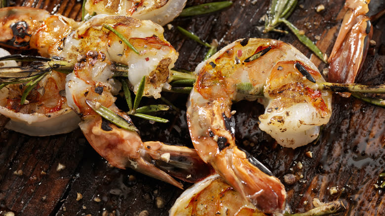 Close-up of grilled shrimp and rosemary