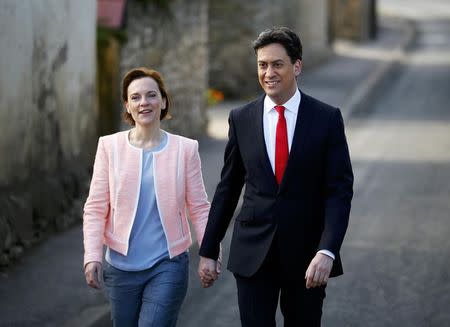 Britain's opposition Labour Party leader Ed Miliband arrives to vote with his wife Justine in Doncaster, northern England, Britain, May 7, 2015. REUTERS/Darren Staples