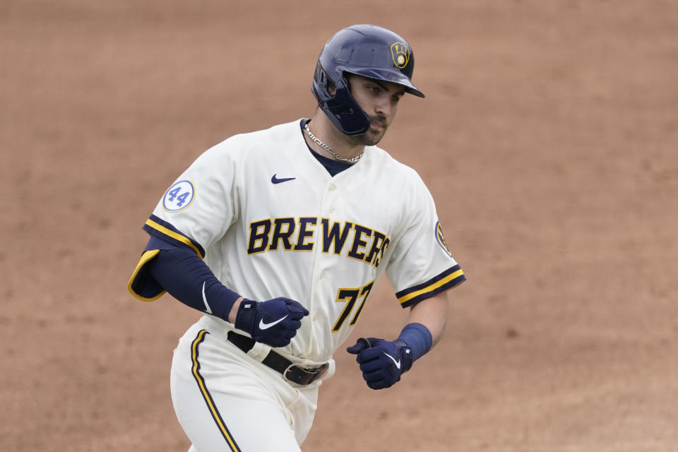 Milwaukee Brewers' Garrett Mitchell (77) runs the bases after hitting a home run during the third inning of a spring training baseball game against the Texas Rangers Saturday, March 13, 2021, in Phoenix. (AP Photo/Ashley Landis)