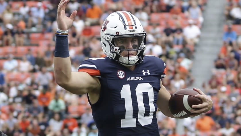 Auburn quarterback Bo Nix (10) carries the ball during the first half of an NCAA football game Saturday, Sept. 11, 2021, in Auburn, Ala. (AP Photo/Butch Dill)