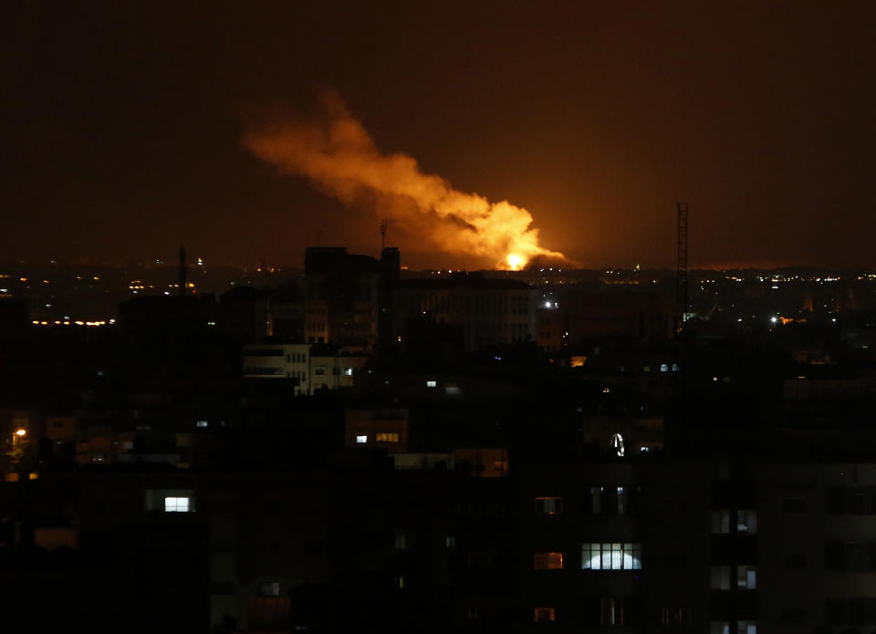 Smoke rises from an explosion caused by an Israeli airstrike on Gaza City, early Saturday, Oct. 27, 2018. Israeli aircraft struck several militant sites across the Gaza Strip early Saturday shortly after militants fired rockets into southern Israel, the Israeli military said. (AP Photo/Adel Hana)