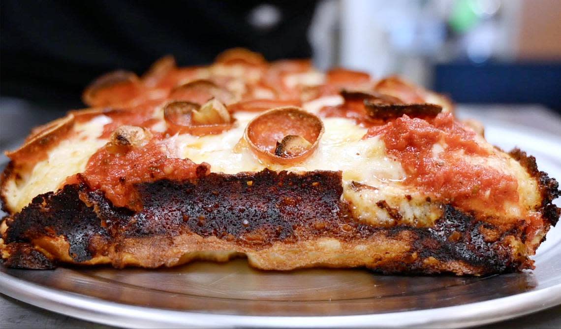 99 Craft Pizza’s rectangular Detroit-style Pinnacles PBR pizza is shown with dark edges where cheese has caramelized between the crust and the edge of the pan Wednesday, Aug. 3, 2022 in Fresno.