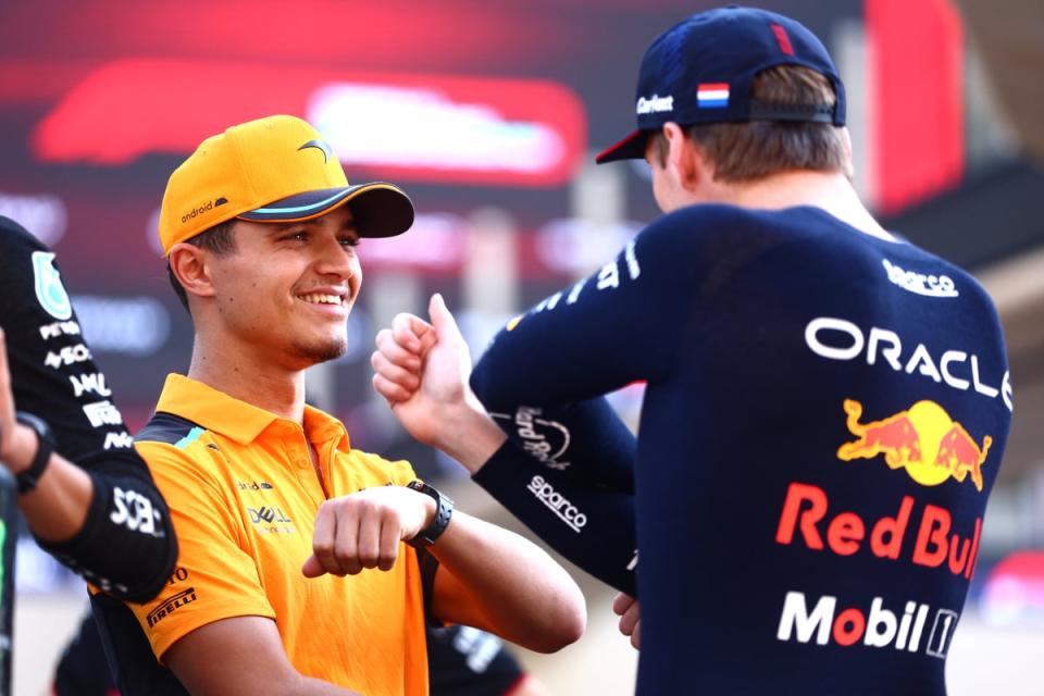 Norris has been linked with a move to Red Bull to partner Max Verstappen (right) (Getty)