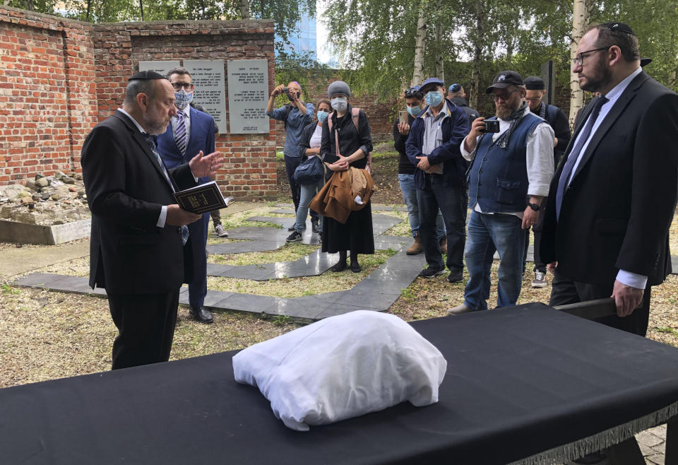 Warsaw's Jewish community held a funeral for an unidentified Holocaust victim after human remains were recently discovered in an area that belonged to the Warsaw Ghetto during World War II, in Warsaw, Poland, Tuesday Sept. 14, 2021. The remains were buried in Warsaw's Jewish Cemetery, with the country's chief rabbi saying, "We are here as the family for a person we don't know." (AP Photo/Vanessa Gera)