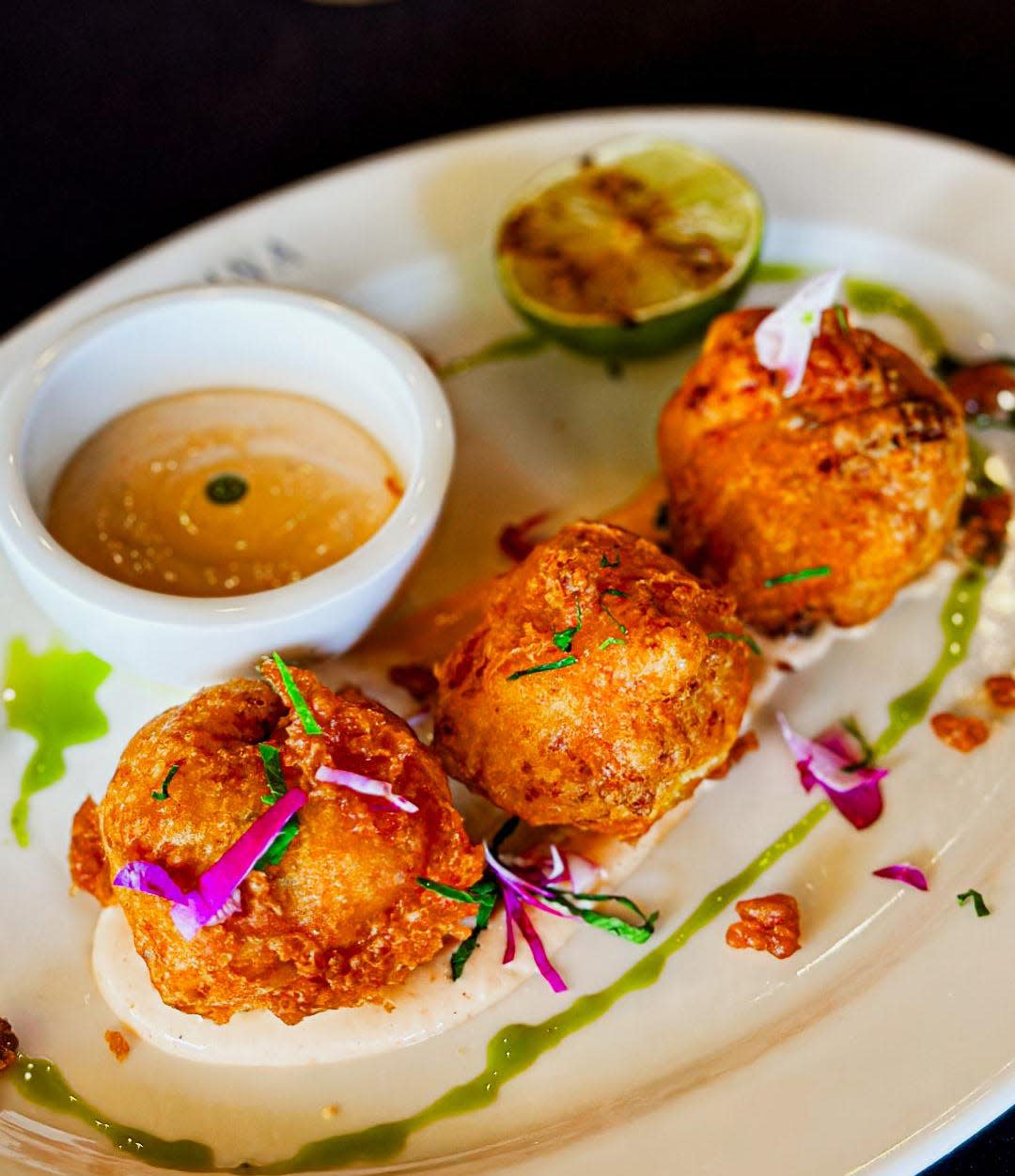 The lobster beignets at Cucina are almost entirely lobster, mixed with a small amount of onion, garlic, spices, egg and parmigiano.