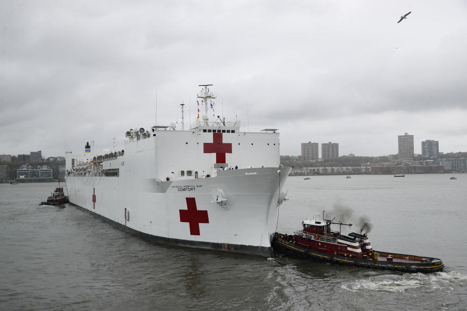 The USNS Naval Hospital Ship Comfort departs via the Hudson River, Thursday, April 30, 2020, in the Manhattan borough of New York. (AP Photo/John Minchillo)