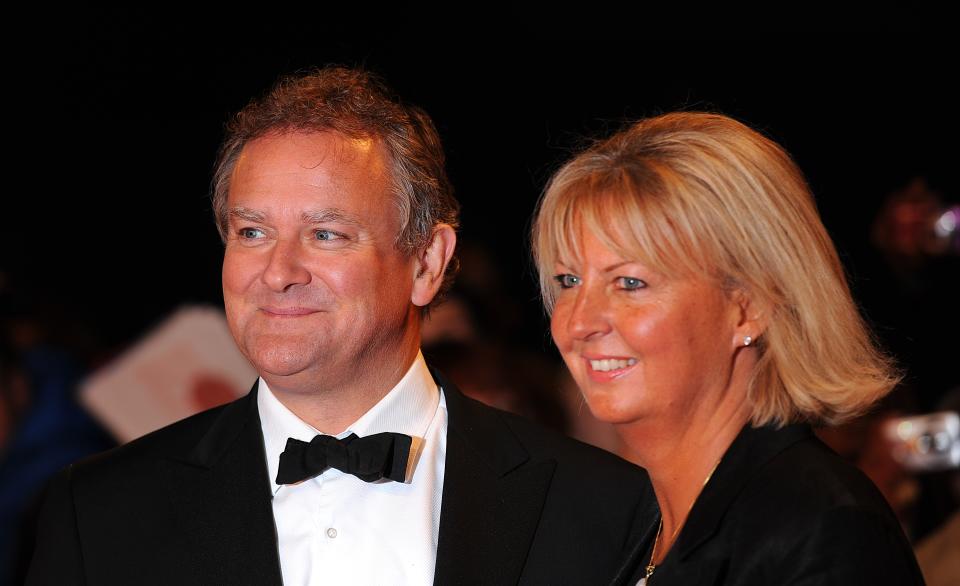 Hugh Bonneville with wife Lulu Evans arriving for the 2013 National Television Awards at the O2 Arena, London. (Photo by Dominic Lipinski/PA Images via Getty Images)