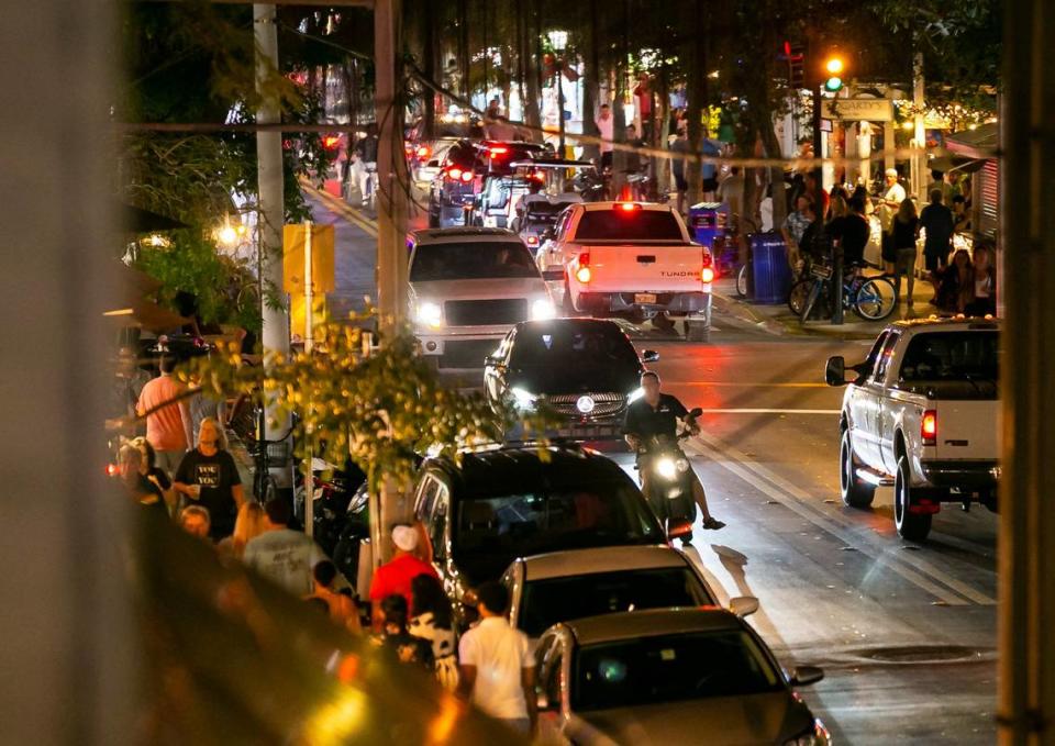 Traffic makes its way down Duval Street in Key West, Florida on Saturday, December 11, 2021.