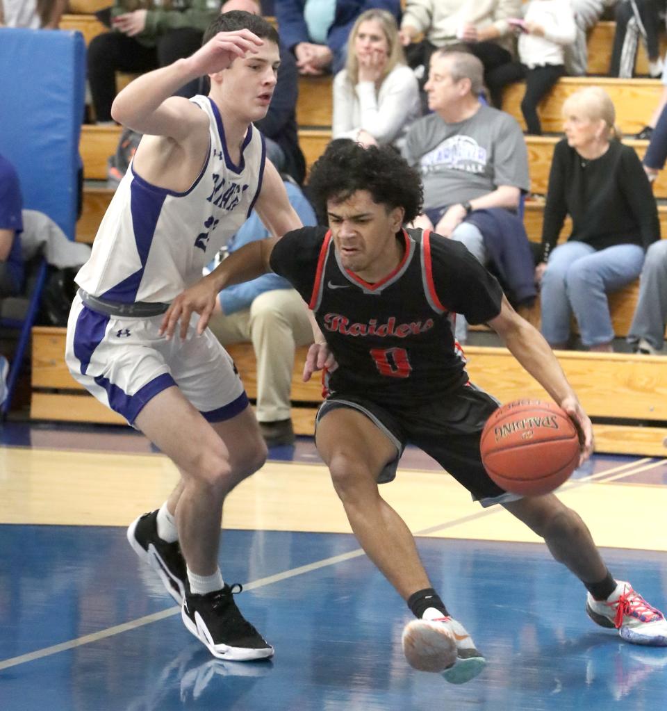 North Rockland's Julian Martinez drives past Pearl River's Brendan Orr during their game at Pearl River Jan. 25, 2024. North Rockland won 44-42.