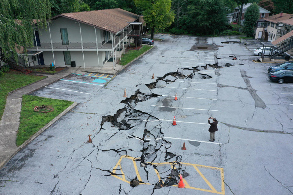 An aerial view shows damage to a parking lot after historic rainfall north of New York City triggered dozens of water rescues and led to roadways being washed out after more than a half-foot of rain fell in only a few hours Sunday in Orange County, New York, United States on July 10, 2023. / Credit: Lokman Vural Elibol/Anadolu Agency via Getty Images