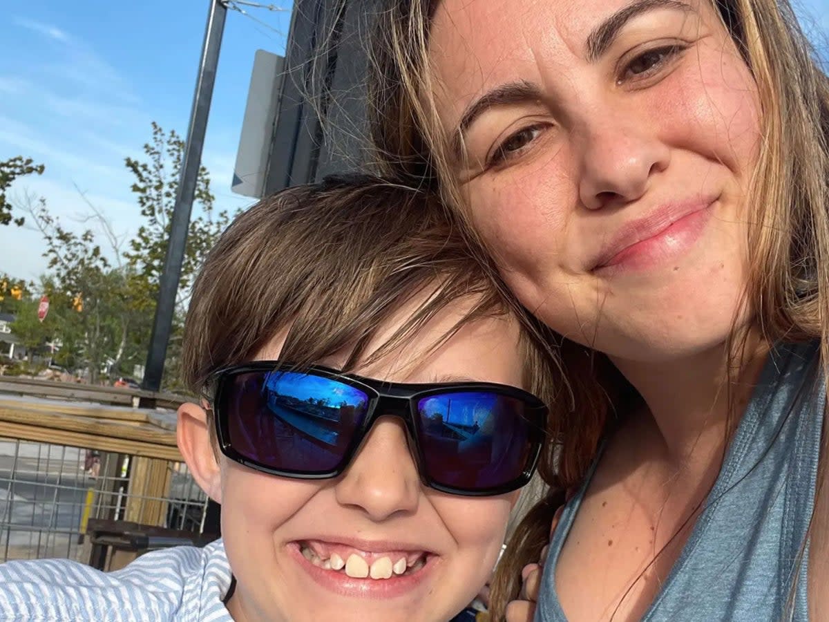 Carson Dunn, 10, with his mother Carly Burgess. Carson died after falling from a play structure in Camp Dearborn, Michigan. (Carly Burgess/Facebook)