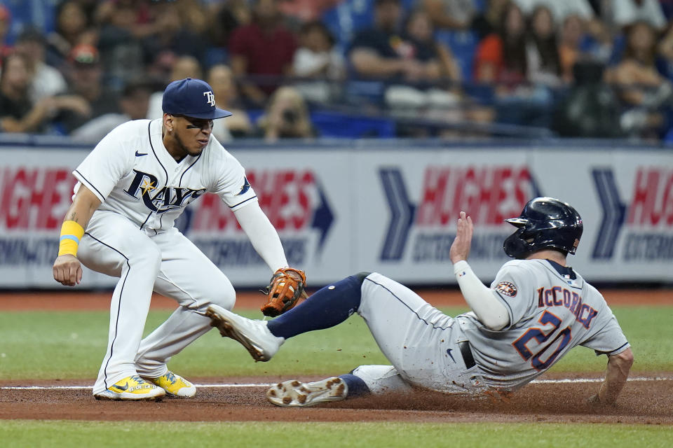 Tampa Bay Rays third baseman Isaac Paredes tags out Houston Astros' Chas McCormick (20) at third base during the fifth inning of a baseball game Wednesday, Sept. 21, 2022, in St. Petersburg, Fla. McCormick tried to go from first base to third on a single by Martin Maldonado. (AP Photo/Chris O'Meara)