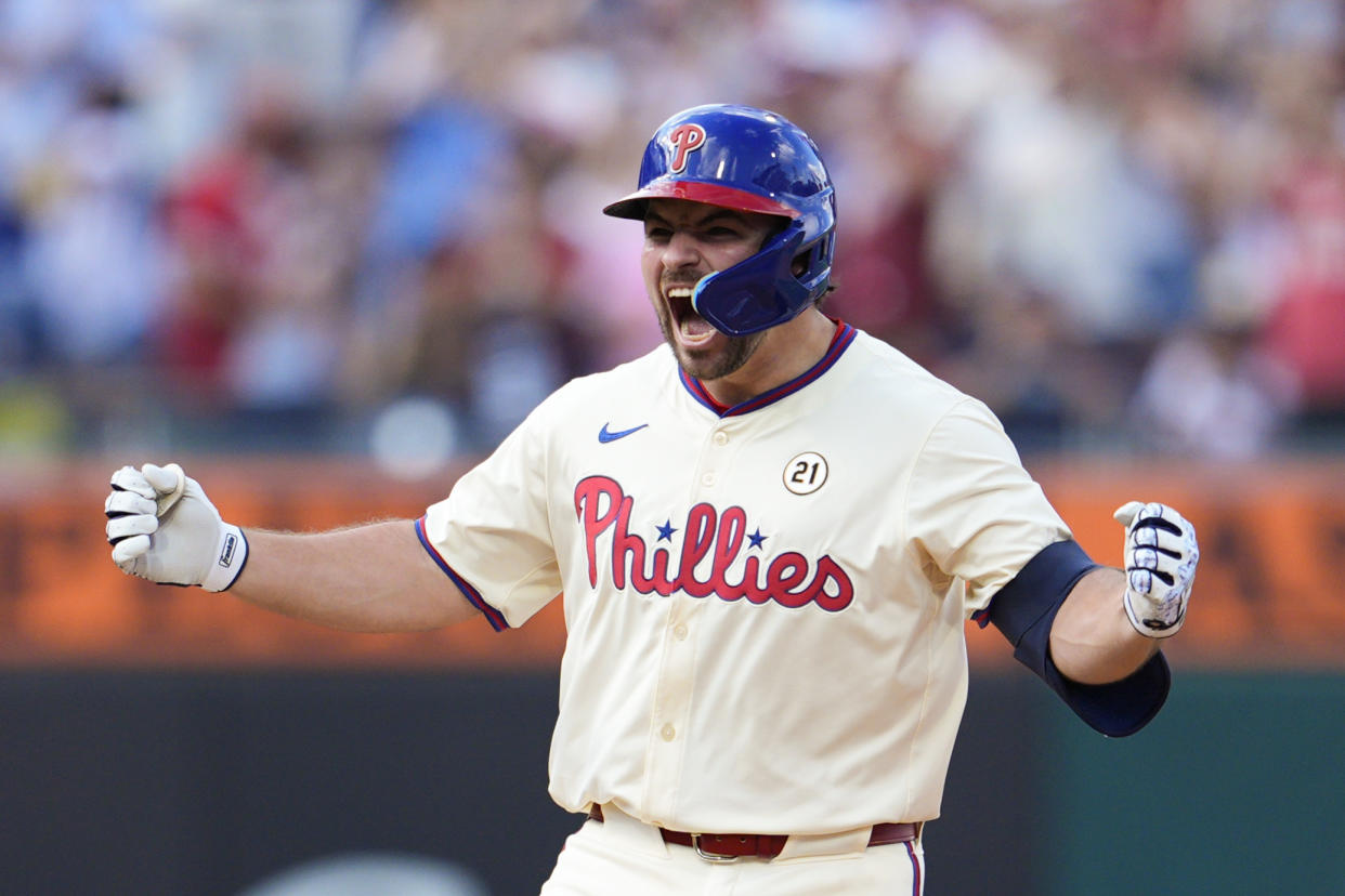 Philadelphia Phillies' Buddy Kennedy reacts after hitting an RBI double off New York Mets' David Peterson during the eighth inning of a baseball game, Sunday, Sept. 15, 2024, in Philadelphia. (AP Photo/Derik Hamilton)