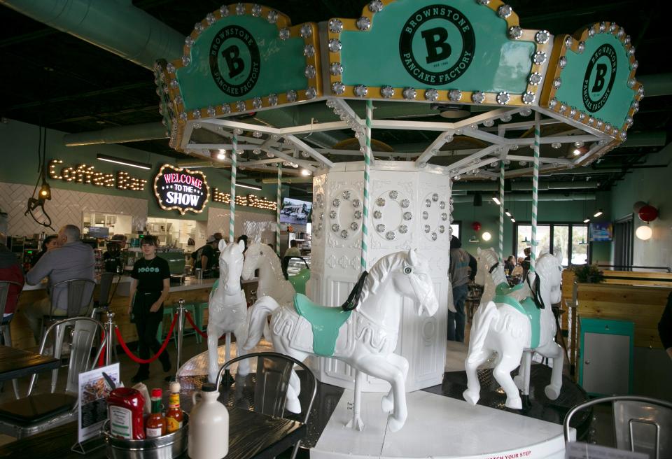 The carousel and dining room inside Brownstone Pancake Factory's Freehold location.