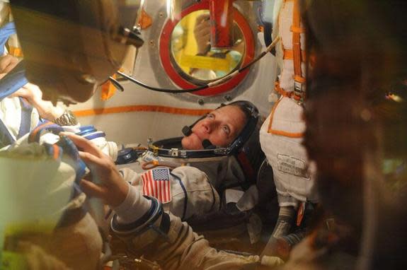 NASA's Karen Nyberg sits in the Soyuz spacecraft that is scheduled to launch her and two other astronauts to the International Space Station on May 28. Image released on May 17, 2013