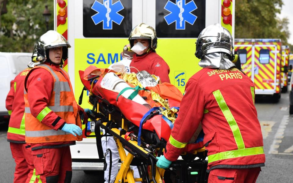 Firefighters were seen rushing injured individuals into ambulances - ALAIN JOCARD /AFP