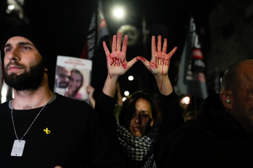 Relatives and supporters of the Israeli hostages held in Gaza by Hamas attend a protest calling for their release outside the Knesset, Israel’s parliament (AP)