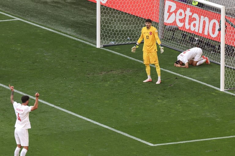 Samet Akaydin's own goal put Portugal two goals ahead (KENZO TRIBOUILLARD)