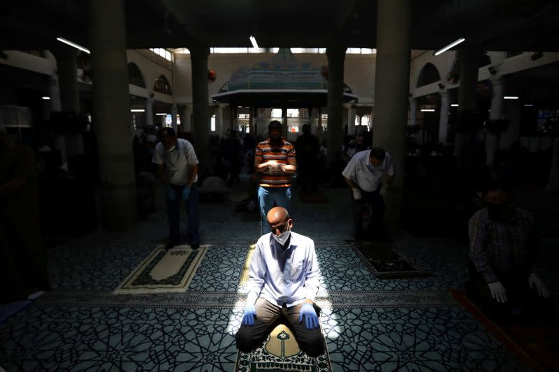 Muslims attend Friday prayers at al Husseini mosque in Amman