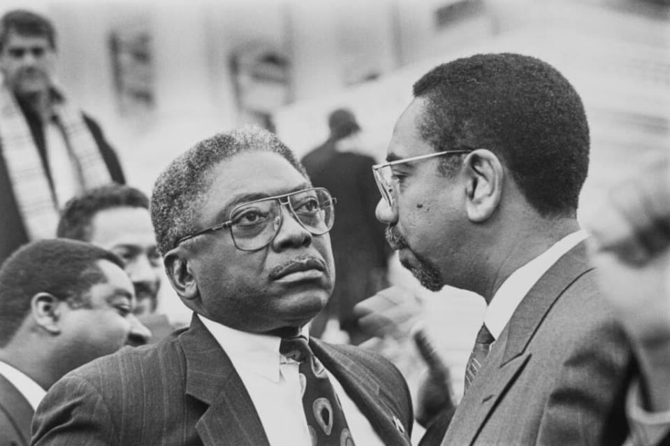 Rep. Jim Clyburn, D-S.C. with Bobby Rush, D-Ill. after Freshman Class Portrait on Dec. 2, 1992. (Photo by Maureen Keating/CQ Roll Call via Getty Images)”n