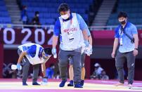 <p>Disinfection against COVID-19 by medical staff during the Tokyo 2020 Summer Olympic Games on July 25, 2021 in Tokyo, Japan, 25/07/2021 ( Photo by Vincent Kalut / Photonews via Getty Images)</p> 