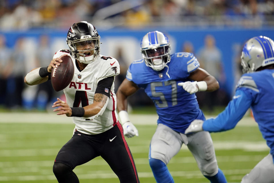 Atlanta Falcons quarterback Desmond Ridder (4) scrambles during the second half of a preseason NFL football game against the Detroit Lions, Friday, Aug. 12, 2022, in Detroit. (AP Photo/Paul Sancya)