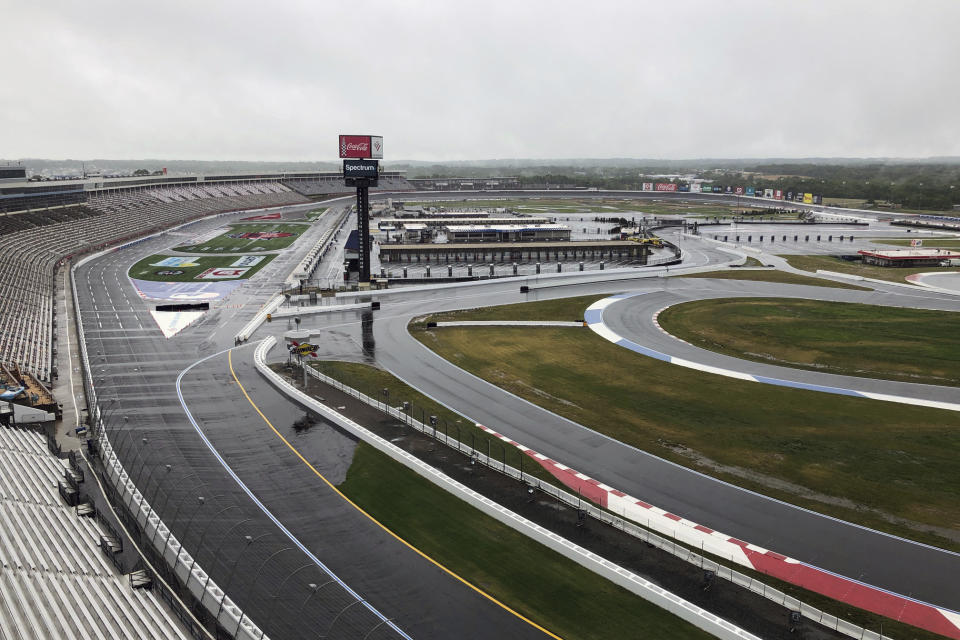 Charlotte Motor Speedway is shown in Concord, N.C., Wednesday, May 20, 2020. Some fans have been coming to the Coca-Cola 600 for decades, but they won’t be allowed into Charlotte Motor Speedwaý on Sunday due to Covid-19, leaving the grandstands empty and many disappointed. (AP Photo/Steve Reed)