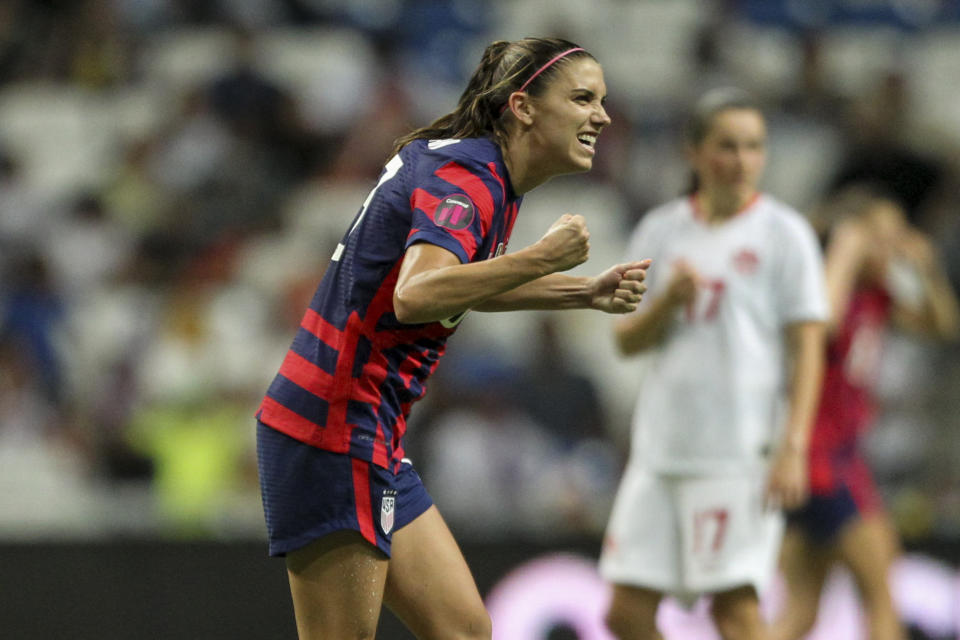 United States' Alex Morgan celebrates scoring her side's opening goal from the penalty spot against Canada during the CONCACAF Women's Championship final soccer match in Monterrey, Mexico, Monday, July 18, 2022. (AP Photo/Roberto Martinez)