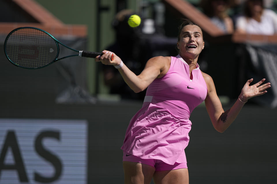 Aryna Sabalenka, of Belarus, returns to Emma Navarro, of the United States, at the BNP Paribas Open tennis tournament, Wednesday, March 13, 2024, in Indian Wells, Calif. (AP Photo/Mark J. Terrill )