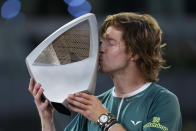 Andrey Rublev, of Russia kisses his trophy after winning against Felix Auger-Aliassime, of Canada, in the Madrid Open men's final match in Madrid, Spain, Sunday, May 5, 2024. (AP Photo/Manu Fernandez)