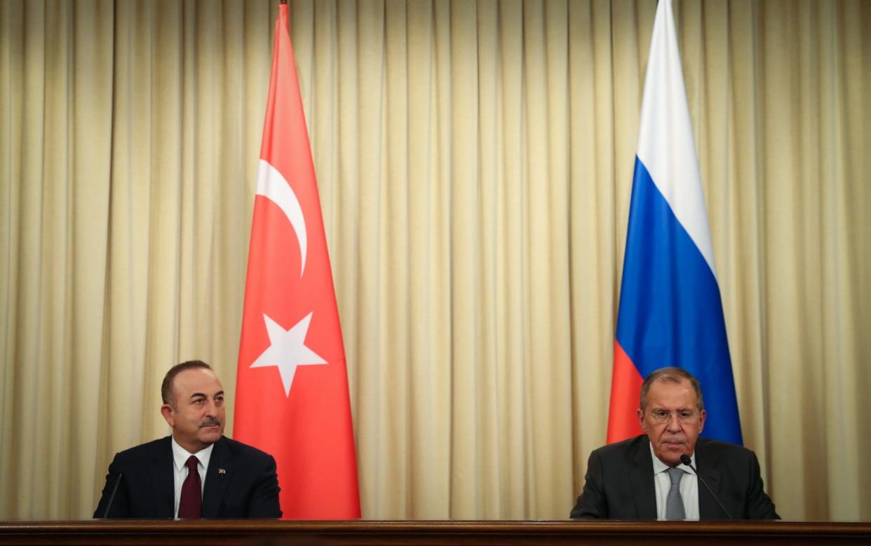 Turkish Foreign Minister Mevlut Cavusoglu and Russian Foreign Minister Sergey Lavrov hold a press conference following the marathon meeting - Anadolu
