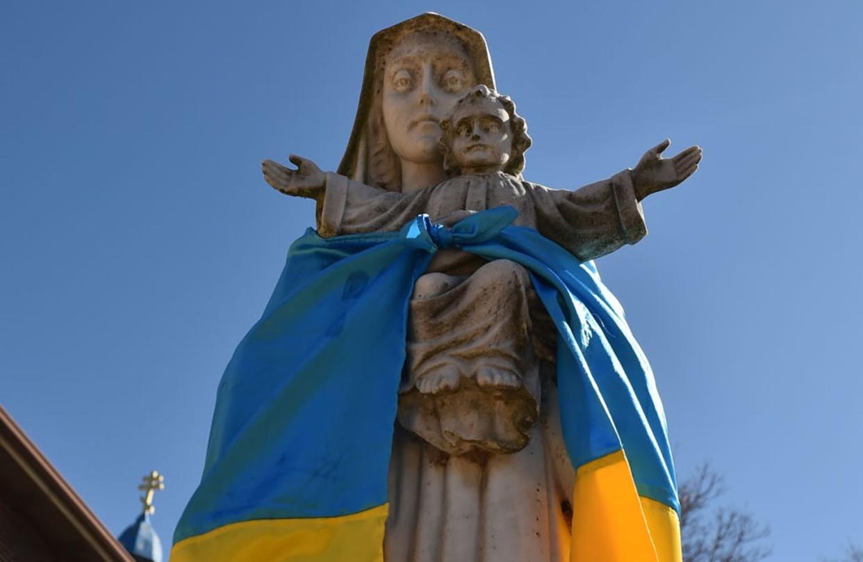 <span class="caption">The flag of Ukraine has been tied around a statue of the Virgin Mary and <span class="caas-xray-inline-tooltip"><span class="caas-xray-inline caas-xray-entity caas-xray-pill rapid-nonanchor-lt" data-entity-id="Jesus" data-ylk="cid:Jesus;pos:2;elmt:wiki;sec:pill-inline-entity;elm:pill-inline-text;itc:1;cat:ReligiousFigure;" tabindex="0" aria-haspopup="dialog"><a href="https://search.yahoo.com/search?p=Jesus" data-i13n="cid:Jesus;pos:2;elmt:wiki;sec:pill-inline-entity;elm:pill-inline-text;itc:1;cat:ReligiousFigure;" tabindex="-1" data-ylk="slk:Jesus Christ;cid:Jesus;pos:2;elmt:wiki;sec:pill-inline-entity;elm:pill-inline-text;itc:1;cat:ReligiousFigure;" class="link ">Jesus Christ</a></span></span> outside a church in Pennsylvania amid the Russian invasion.</span> <span class="attribution"><span class="source">Aimee Dilger/SOPA Images/LightRocket via Getty Images</span></span>