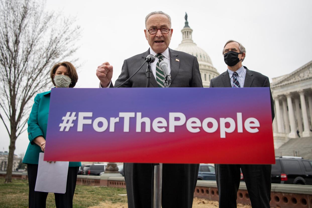 Senate Majority Leader Chuck Schumer (D-N.Y.) and Sens. Amy Klobuchar, (D-Minn.) and Jeff Merkley (D-Ore.) introduce the Senate version of the For The People Act on March 17. (Photo: Caroline Brehman via Getty Images)