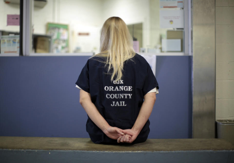 An inmate is checked into the Orange County jail in Santa Ana, California, May 24, 2011. The U.S. Supreme Court upheld on Monday an order that California reduce its overcrowded prisons by some 40,000 inmates to fix longtime problems with inadequate medical and mental health care. Officials plan to move low-level offenders to county jails.  REUTERS/Lucy Nicholson (UNITED STATES - Tags: SOCIETY CRIME LAW)