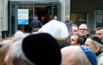 People wear kippas as they attend a demonstration in front of a Jewish synagogue, to denounce an anti-Semitic attack on a young man wearing a kippa in the capital earlier this month, in Berlin, Germany, April 25, 2018. REUTERS/Fabrizio Bensch