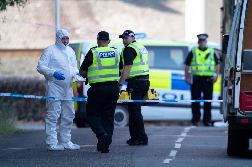 Forensic officers on Ardbeg Road on the Isle of Bute after officers found the body of Alesha MacPhail (Jane Barlow/PA)