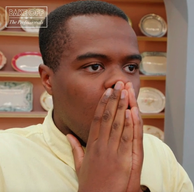 A man covering his face in shock