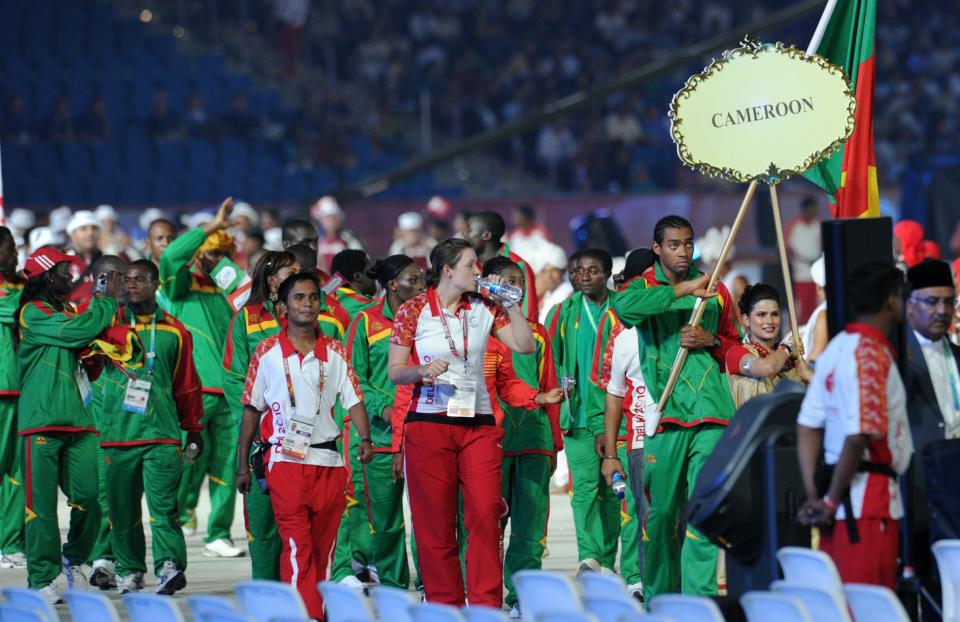 Cameroon athletes led by flag bearer Hug