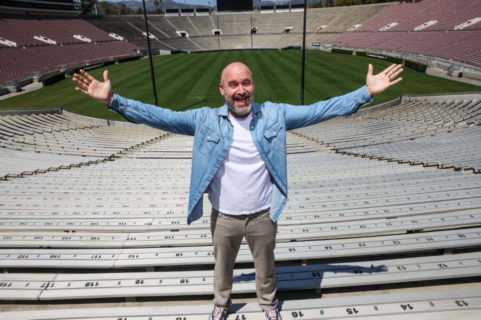 Man standing in the bleachers at Rose Bowl