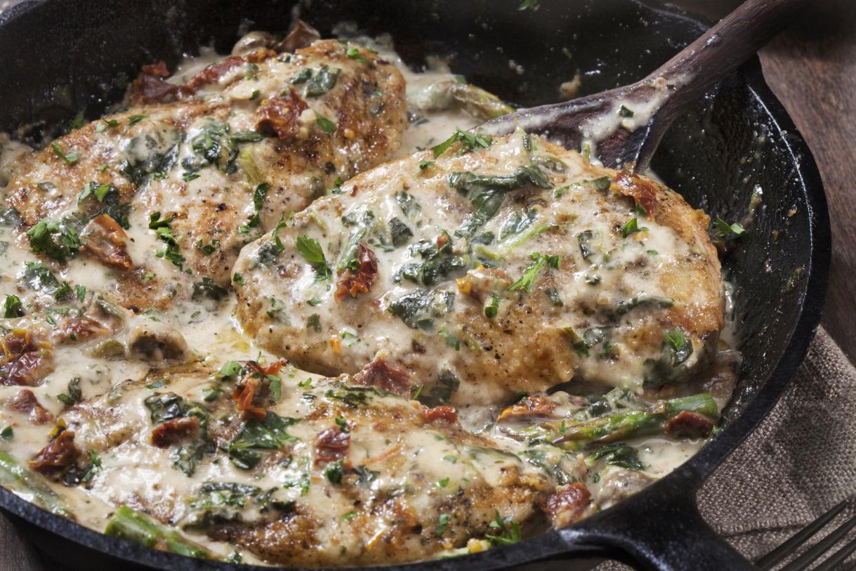 Tuscan Chicken in a Creamy Parmesan Sauce with Spinach, Sun Dried Tomatoes, Pasta and Artisan Bread